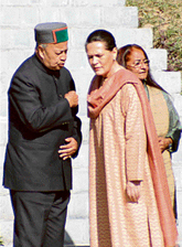 UPA chairperson Sonia Gandhi listens to Chief Minister Virbhadra Singh during the unveiling of the statute of late Rajeev Gandhi Memorial Ayurvedic College at Paprola, 50 km from Dharamsala.