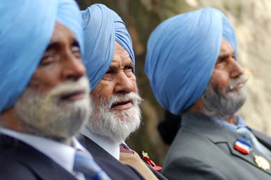 Sikh men attend a remembrance service for the five million people from the Indian sub-continent, Africa and the Caribbean who served with Britain in the two world wars in Hyde Park in central London on Friday