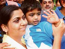 Three-year-old Anant Gupta, who returned home after being kidnapped three days ago, with his mother at their residence in Noida on Friday. 