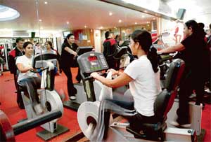 City gyms are abuzz with fitness enthusiasts after the sun goes down