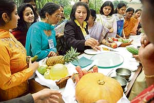 Women try out vegetable carving at the Taj, Chandigarh.