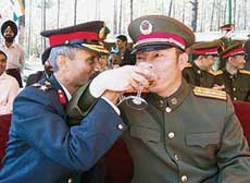 Arunachal peg: Brigadier A.K. Bordoloi of the Indian Army and Colonel Li Shi Zhong of the Chinese army tost on the occasion of Year of Friendship 2006 at Washa Pass, Kibithu, in Arunachal Pradesh under Lohit district. 