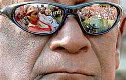Participants in the Left-led rally reflected on the glasses of CPI general secretary A B Bardan, during the public meeting after the rally, in New Delhi on Thursday 