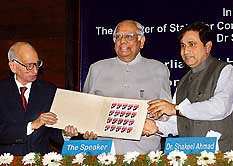 Tribune Trust Chairman Justice R.S. Pathak, Lok Sabha Speaker Somnath Chatterjee, and Minister of State for Communication and IT Shakeel Ahmed during the release of the commemorative stamp on the 125th anniversary of The Tribune at a function in New Delhi on Friday.