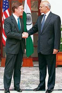 US Under Secretary of State Nicholas Burns shakes hands with Foreign Secretary Shivshankar Menon prior to a meeting at Hyderabad House in New Delhi