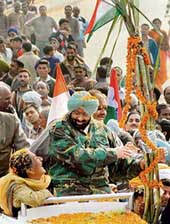 Capt Amarinder Singh tries to add sweetness to the third round of Punjab Vikas Yatra by sharing sugarcane presented to him by local villagers with Union Tourism Minister Ambika Soni at Garhshanker on Monday.