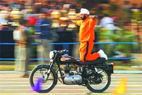 A Punjab Police jawan performs a daring act during the concluding ceremony of the police games held recently on the PAP campus in Jalandhar