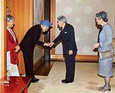 Prime Minister Manmohan Singh, accompanied by his wife Gursharan Kaur, is greeted by Japanese Emperor Akihito upon his arrival at the Imperial Palace in Tokyo on Thursday.