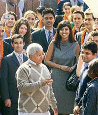 Railways Minister Lalu Prasad Yadav meets students of the Harvard and Wharton Business School at the National Rail Museum in New Delhi