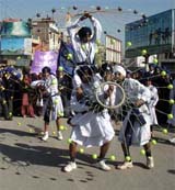 Sikh youth perform gatka during a procession on the occasion of Gurpurb of Guru Gobind Singh