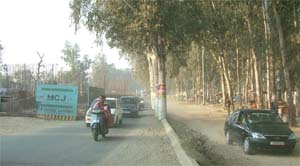 Commuters have a tough time near the DAV railway crossing as the construction company has covered