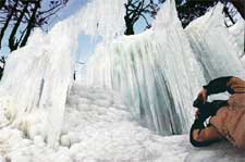 A photographer captures icicles at the Gulmarg ski resort, 55 km from Srinagar, on Sunday