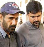 Moin Khan arrives at a court in Karachi