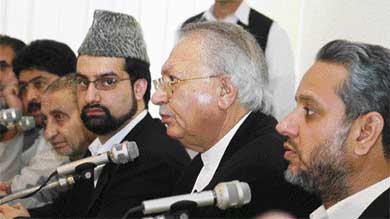 Chairman of the moderate faction of the All-Parties Hurriyat Conference Mirwaiz Umar Farooq, Abdul Gani Bhat and Bilal Gani Lone listen to the President of Pakistan-administered Kashmir Raja Zulqarnain Khan, as the Prime Minister of Pakistan-Administered Kashmir Sardar Atiq Khan watches, during a meeting in Islamabad