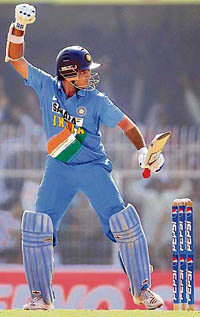Sourav Ganguly celebrates his 61st one-day half-century during the first match against the West Indies at the Vidarbha Cricket Association Stadium in Nagpur on Sunday. India won by 14 runs.