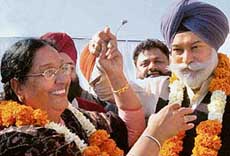 OSD to the Chief Minister Lakhvinder Kaur Garcha joins hands with Mr Bir Devinder Singh at a rally in Mohali on Sunday.
