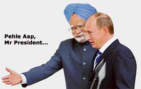 Russian President Vladimir Putin is welcomed by Prime Minister Manmohan Singh in New Delhi