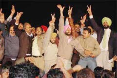 The BJP candidate for the Amritsar Lok Sabha seat, Mr Navjot Singh Sidhu (extreme right), and his rival from the Congress, Mr Surinder Singla (left), along with their supporters capture the dais at a debate being aired live in Amritsar