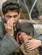 The father and son of Ghulam Nabi Wani of Kokernag break down on seeing his decomposed body. Nabi was killed in a fake encounter by the police