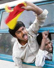 Members of Kannada Rakshan Vedike shouts slogans near the Bangalore railway station on Monday against the verdict on the Cauvery water dispute. 