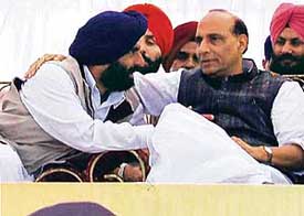 BJP president Rajnath Singh and SAD nominee for Kharar Jasjit Singh at an election rally in Kharar on Monday