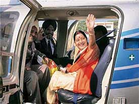 BJP leader Sushma Swaraj waves from a helicopter in Ambala as she heads for the election campaign in Punjab on Monday