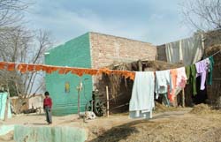 ALL ON THE SAME LINE: Election banners and clothes hang listlessly in the afternoon sun in Baupur.