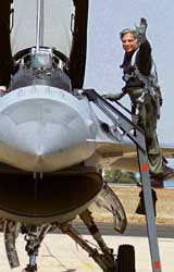 Tata Group Chairman Ratan Tata waves to mediapersons before entering the cockpit of US fighter plane F-16 as co-pilot at the Aero India 2007 in Bangalore on Thursday