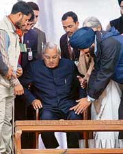 Amritsar candidate Navjot Singh Sidhu greets Atal Bihari Vajpayee at a rally in Amritsar on Saturday. On a rain-marred day, Vajpayee commented how the weather was changing. 