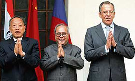 External Affairs Minister Pranab Mukherjee, Chinese Foreign Minister Li Zhaoxing (left) and Russian Foreign Minister Sergey Lavrov (right) share a light moment before their meeting at Hyderabad House in New Delhi on Wednesday.