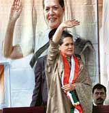Congress chief Sonia Gandhi waves to the crowd at an election rally in New Tehri on Friday