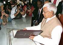 Railway minister Lalu Prasad poses for photographers on Sunday