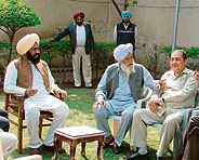 Shamsher Singh Dullo( left) with supporters at his house in Khanna