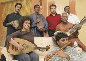 Eight musicians of Darb Al-Harir get ready to perform in the city