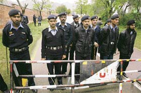 Pakistani policemen stand guard near the residence of suspended Supreme Court chief justice Iftikhar Chaudhary in Islamabad