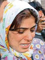 A relative of one of the Sikkim police jawans cries outside the Dena Bank premises in New Delhi
