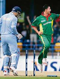 Virender Sehwag is bowled by Bangladesh’s Mashrafee Mortaza during the Group B match at the Queen’s Park Oval in Port of Spain on Saturday. India were dismissed for 191 in 49.3 overs.