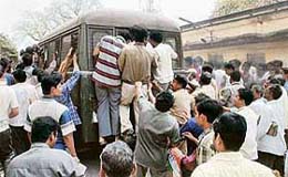 A violent mob tries to open the door and free the persons arrested by the CBI team as they are brought to be produced before a court at East Midnapur