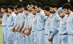 The Indian team observes a two-minute silence for Pakistan coach Bob Woolmer prior to their match against Bermuda at Port of Spain, Trinidad