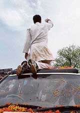 Rahul Gandhi waves to supporters during an election rally in Bareilly on Tuesday
