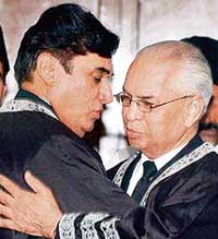 Pakistan Supreme Court Senior Judge Javed Iqbal (left) congratulates Acting Chief Justice Rana Bhagwandas in Karachi on Saturday.