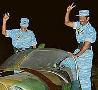 This undated picture released by Tamil Tiger rebels on Monday shows two unidentified Tiger rebels flash the "V" sign from their light aircraft somewhere in the rebel-held region.