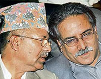 Nepalese Maoist chairman Prachanda (right) and Communist Party of Nepal (Marxist and Leninist) general secretary Madhav Kumar Nepal during the oath taking ceremony on Sunday.