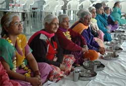 Mentally-challenged elderly women wait for the langar at Vidya Sagar Institute of Mental Health in Amritsar.