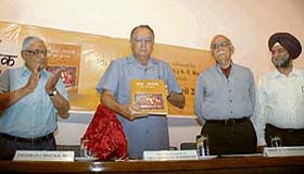 UT Administrator Gen S F Rodrigues (retd) releases the Hindi translation of �Guru Nanak: His Life and Teachings� by Roopinder Singh (extreme right) along with Mr H K Dua, Editor-in-Chief of The Tribune (extreme left) and eminent historian Dr B N Goswami.