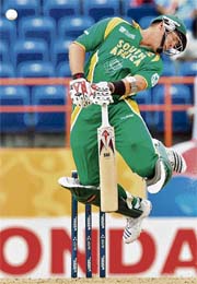 South African batsman Jacques Kallis stretches to avoid a bouncer off Shane Bond during the World Cup Super Eight match against New Zealand