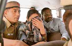 Babu Bhai Katara, BJP MP from Dahod (Gujarat) along Paramjeet after they were detained before boarding a flight to Toronto at the IGI airport in New Delhi on Wednesday. 