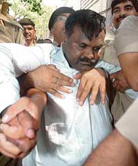 BJP MP from Gujarat Babubhai Khimabhai Katara is produced in Patiala House Court in New Delhi on Thursday.