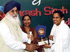 Punjab Chief Minister Parkash Singh Badal welcomes Vidya Khemka, director, Sun Group, at Badal village on Monday.