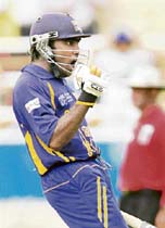 Sri Lankas Mahela Jayawardene celebrates after scoring a century against New Zealand during the first semifinal in Kingston on Tuesday. Lanka stormed into the World Cup final with a 81-run victory. 